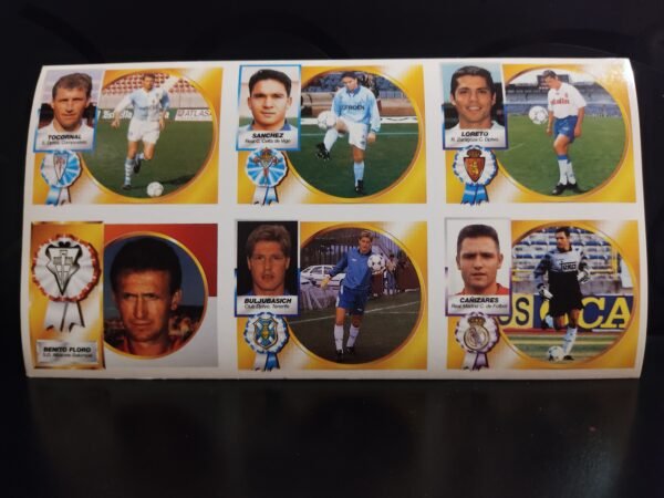 Anverso hoja de cromos Liga 94-95 con datos biográficos y trayectoria de jugadores como Canizares, Loreto, Tocornal, Buljubasich, Sánchez, y el entrenador Benito Floro.
