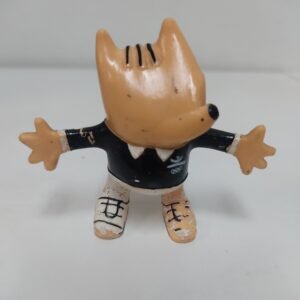Figura vintage de Cobi con traje negro y logo olímpico – Juegos Olímpicos Barcelona 1992
