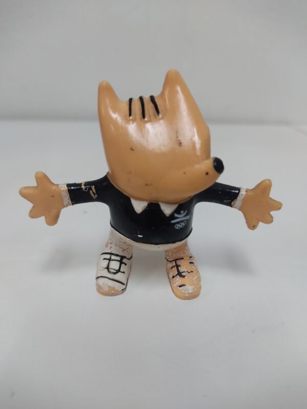 Figura vintage de Cobi con traje negro y logo olímpico – Juegos Olímpicos Barcelona 1992