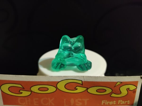 Fotografías de figuras coleccionables Gogo’s Crazy Bones Serie 1 en diversos colores y formas, exhibidas junto a una tarjeta de checklist con el logo oficial.