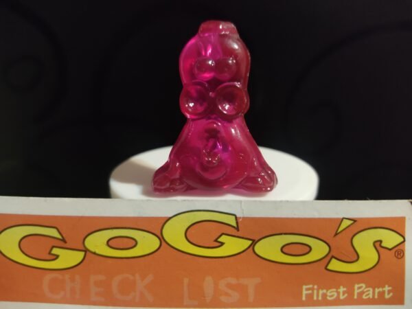 Fotografías de figuras coleccionables Gogo’s Crazy Bones Serie 1 en diversos colores y formas, exhibidas junto a una tarjeta de checklist con el logo oficial.