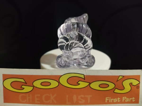 Fotografías de figuras coleccionables Gogo’s Crazy Bones Serie 1 en diversos colores y formas, exhibidas junto a una tarjeta de checklist con el logo oficial.