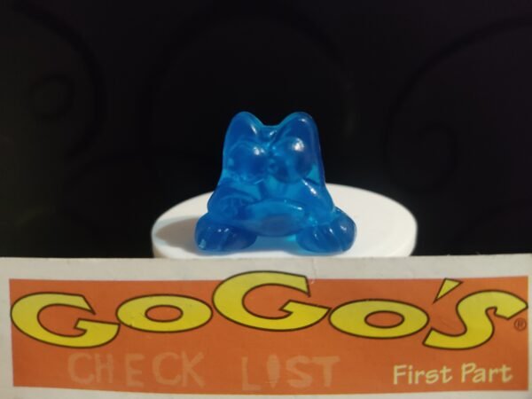 Fotografías de figuras coleccionables Gogo’s Crazy Bones Serie 1 en diversos colores y formas, exhibidas junto a una tarjeta de checklist con el logo oficial.