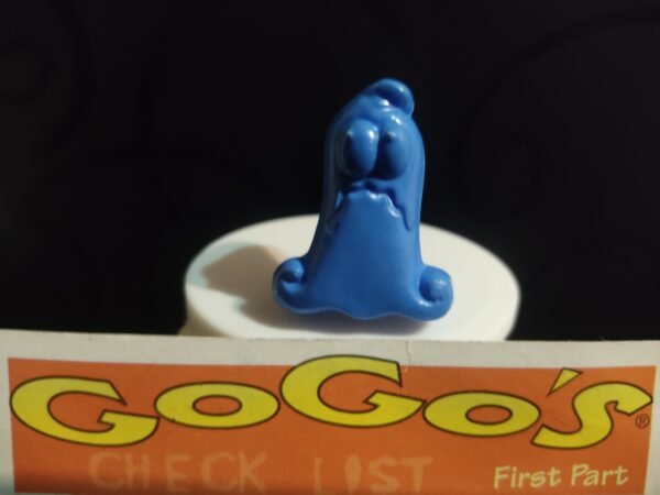 Fotografías de figuras coleccionables Gogo’s Crazy Bones Serie 1 en diversos colores y formas, exhibidas junto a una tarjeta de checklist con el logo oficial.