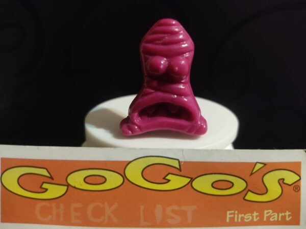 Fotografías de figuras coleccionables Gogo’s Crazy Bones Serie 1 en diversos colores y formas, exhibidas junto a una tarjeta de checklist con el logo oficial.